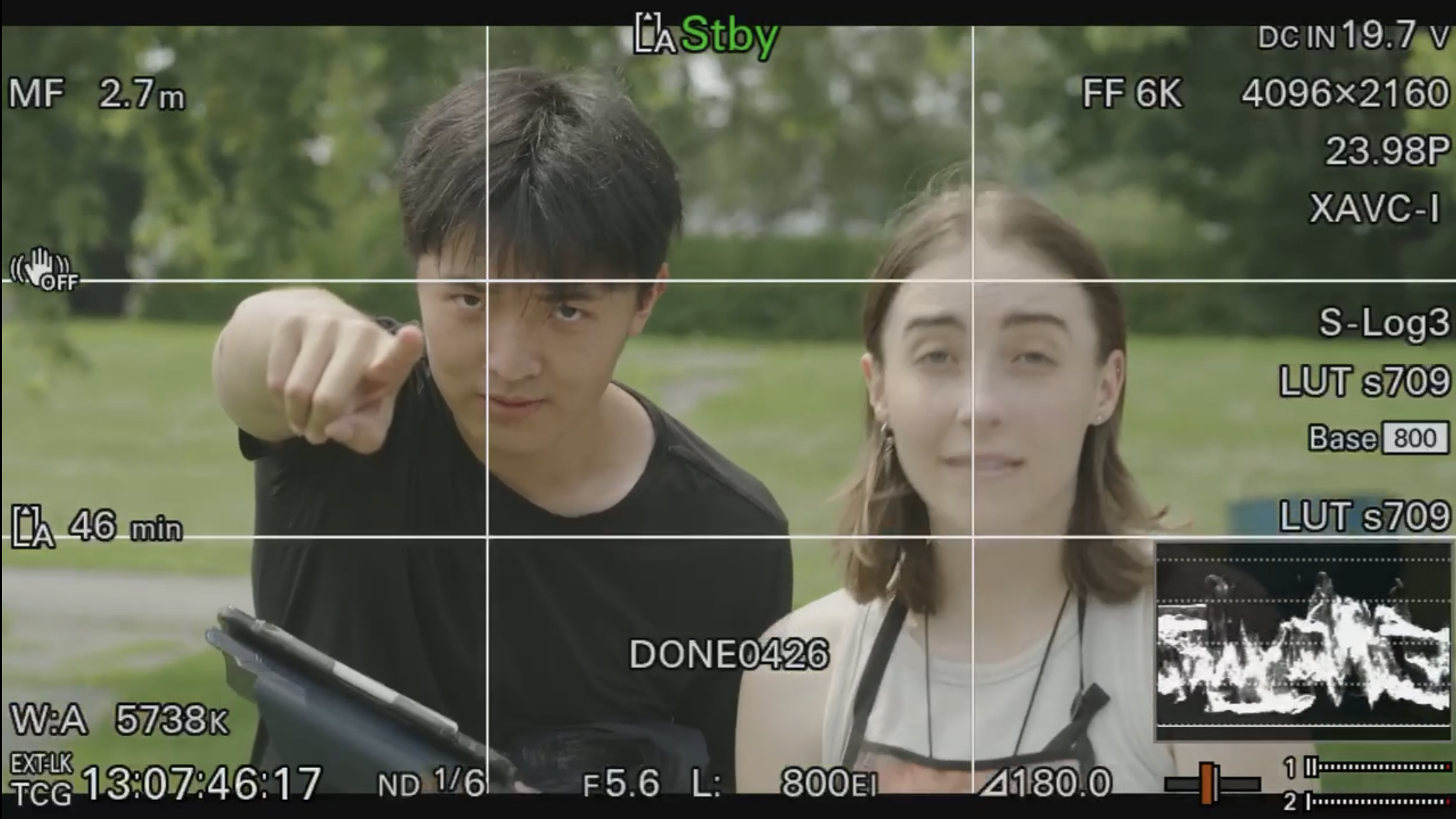 Camera monitor view with Boyi Tan pointing toward the lens